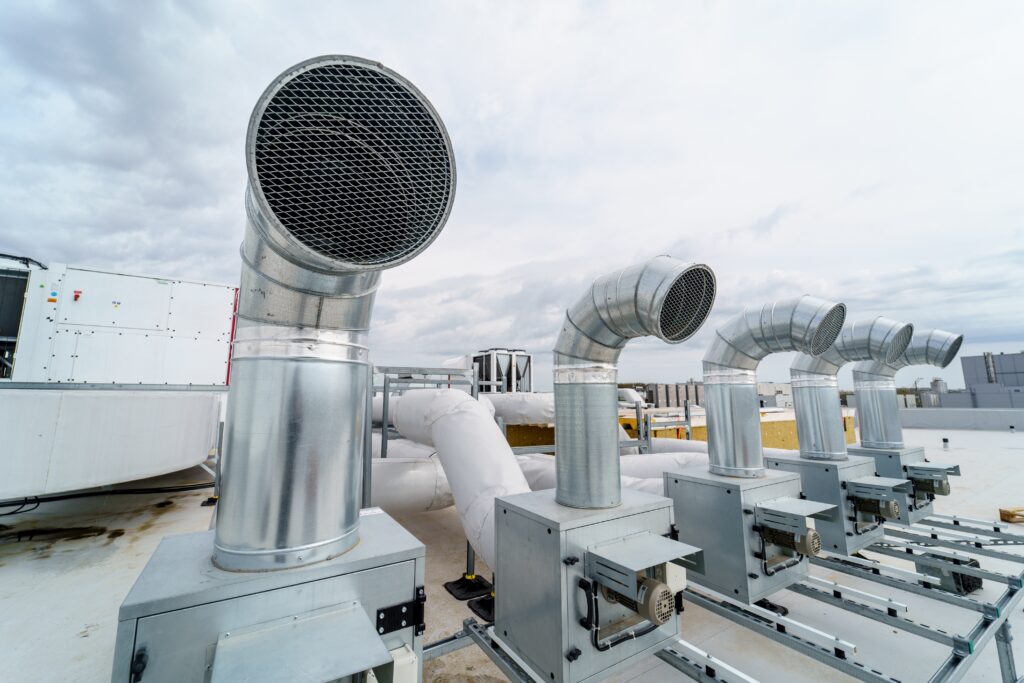 Commercial rooftop HVAC ventilation and exhaust systems installed and maintained by Dowd Heating & Air Conditioning for efficient building airflow and climate control.