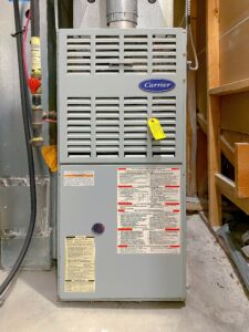 Residential gas furnace installed in a utility area, providing reliable home heating and comfort