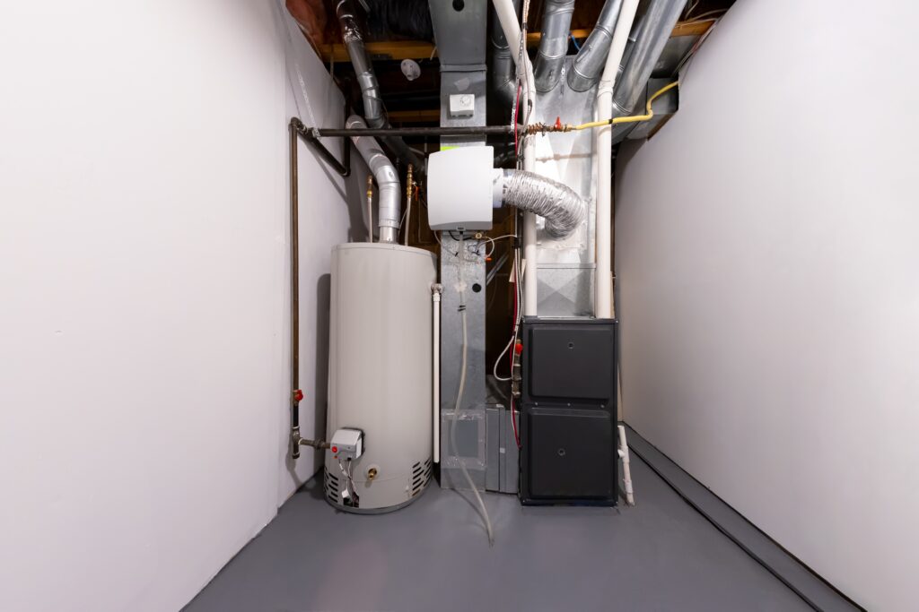 Residential furnace and water heater installed in a utility room as part of a home heating system